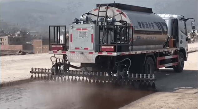 Asphalt distributor truck is paving high way